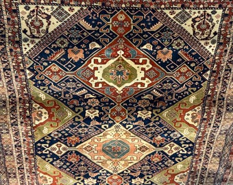 Hand-knotted wool rug with triple medallion design, Qashqai tribal origin, circa 1880