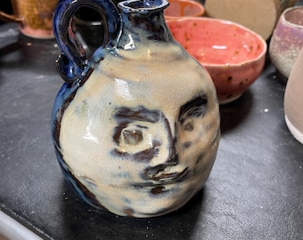 Man in the moon face jug