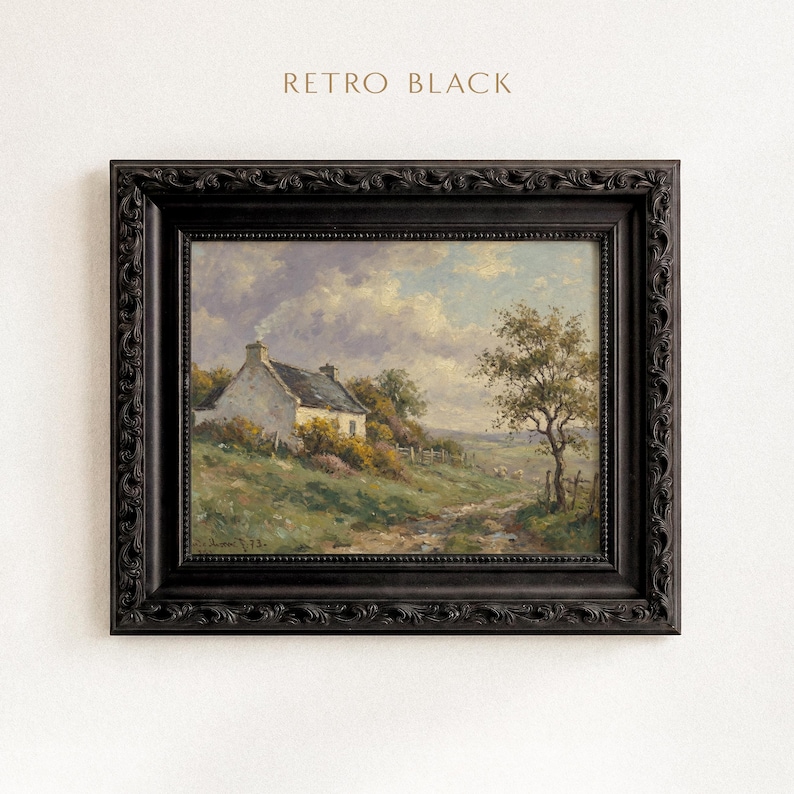 Vintage oil painting of a white stone cottage with a gray roof on a green hillside, surrounded by flowering bushes, a lone tree, and a dirt path under a cloudy sky, displayed in an ornate gold frame.