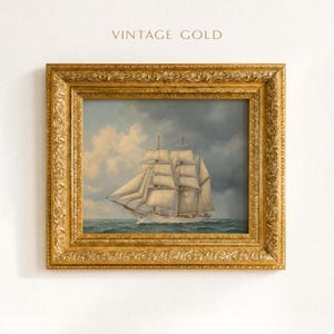 May include: A framed vintage painting of a tall ship sailing on the ocean under a cloudy sky. The ornate gold frame surrounds the artwork, with the words "VINTAGE GOLD" at the top.