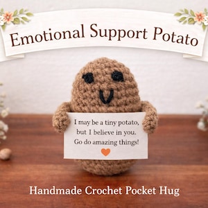 May include: A handmade crochet potato with a smiling face and arms, holding a sign that reads "I may be a tiny potato, but I believe in you. Go do amazing things!" The text "Emotional Support Potato" and "Handmade Crochet Pocket Hug" are also visible.