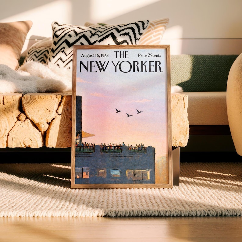 May include: A framed print of a vintage New Yorker magazine cover. The cover features a sunset scene with birds in flight over a building. The text reads "August 16, 1964 THE NEW YORKER Price 25 cents."
