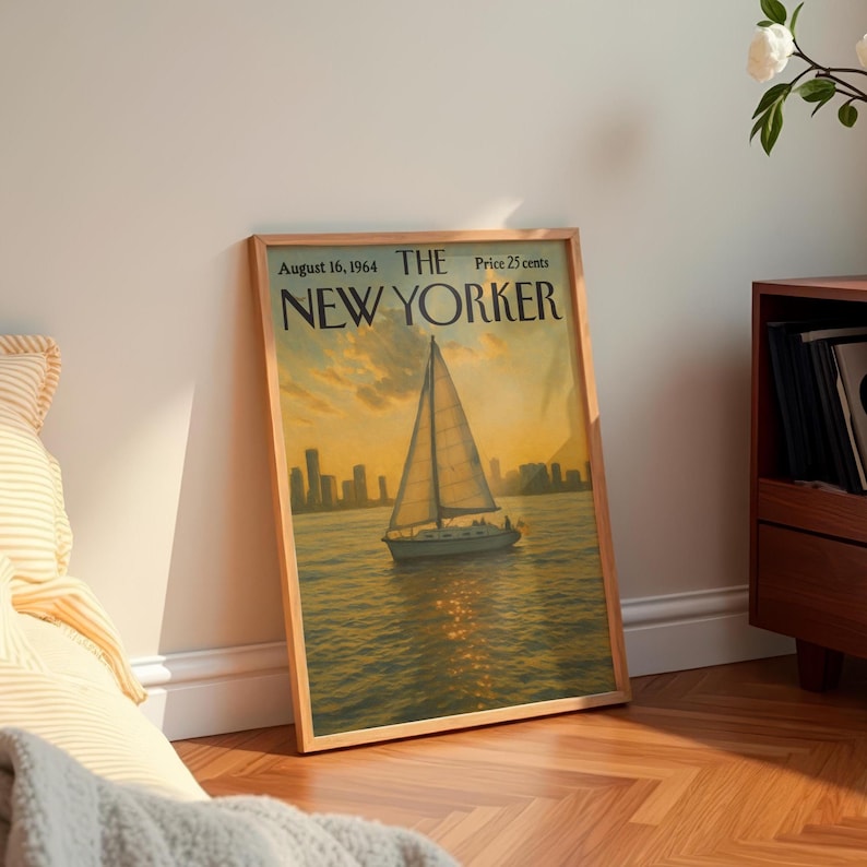 May include: A framed vintage "The New Yorker" magazine cover from August 16, 1964, featuring a sailboat on the water at sunset. The artwork has a warm color palette with a cityscape in the background.