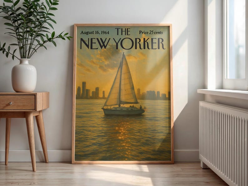 May include: A framed vintage New Yorker magazine cover from August 16, 1964, featuring a sailboat on the water at sunset. The cover art has a warm color palette with a cityscape silhouette in the background. The magazine's title and date are at the top.