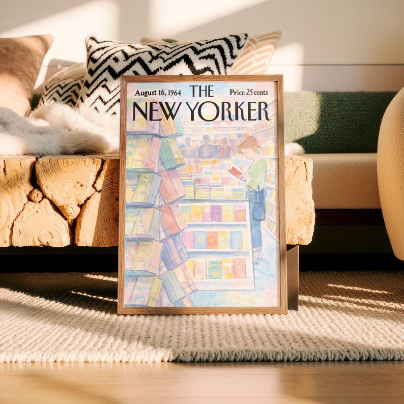 May include: A framed vintage New Yorker magazine cover from August 16, 1964, featuring an illustration of a person reading in a bookstore. The cover art is in soft pastel colors, with the magazine title prominently displayed.