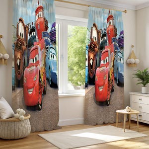 May include: Curtains featuring a vibrant illustration of animated cars, including a red race car and various other car characters. The design is set against a light blue sky background, creating a playful and colorful aesthetic. These curtains are designed for a child's room.