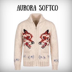 May include: Cream-coloured zip-up cardigan sweater with a shawl collar. The sweater features two fox designs in red, black, and white on the front, with small blue and grey patterns near the pockets and cuffs. The text "AURORA SOFTCO" is above the sweater.