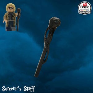 May include: A dark brown Sorcerer's Staff with a detailed, textured top and a curved handle. The staff is featured with a Lego figure of a wizard. The text "Sorcerer's Staff" is at the bottom of the image.