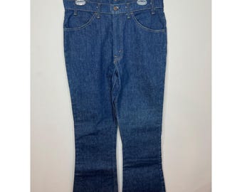 Calça jeans masculina Levi's Vintage anos 70, modelo 646, boca de sino, com etiqueta laranja, tamanho 34x32, ano 1979.