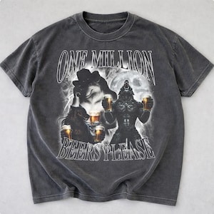 May include: Dark gray t-shirt featuring a graphic of werewolves holding beer mugs under a full moon. The text "ONE MILLION BEERS PLEASE" is printed across the front in a distressed font.