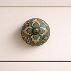 May include: A set of three ceramic mugs with a speckled, matte finish. The mugs are in shades of cream, light gray, and dark gray. Each mug has a simple, minimalist design, perfect for coffee or tea.