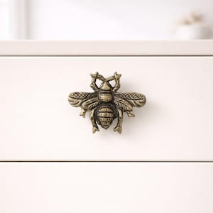 May include: A rustic wooden sign with the text "Welcome to our home" in white lettering. The sign features a distressed finish and a simple, inviting design, perfect for a front porch or entryway.