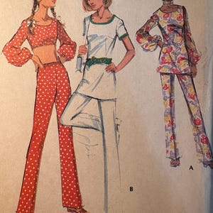 May include: Illustration of three outfits: a red polka-dot crop top and pants, a white top and pants with green trim, and a floral print top and pants. The text "MISSES' COORDINATED SEPARATES" is at the bottom.