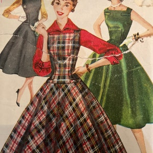 May include: Three vintage fashion illustrations of women wearing dresses. The woman in the centre is wearing a red and black plaid dress with a red collar and long sleeves. The woman on the left is wearing a black dress with a white collar and short sleeves. The woman on the right is wearing a green dress with a white collar and sleeveless.