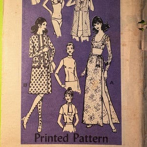 May include: Vintage sewing pattern featuring illustrations of women's clothing designs. The designs include a floral print maxi dress, a jacket and skirt set, and lingerie. The text "Printed Pattern" and "4849 - SIZE 10" are visible on the purple background.