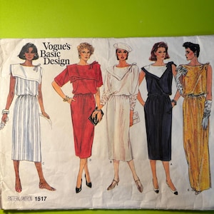 May include: A vintage Vogue's Basic Design sewing pattern featuring five dress designs. The illustrations showcase dresses in various styles and colors, including white, red, navy, and yellow. The pattern number 1517 is visible.