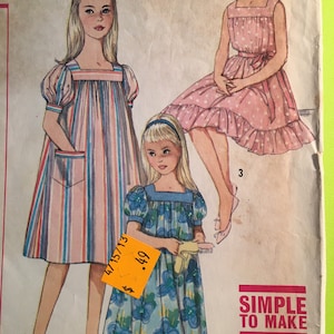May include: Vintage sewing pattern featuring illustrations of three dresses. One dress is striped, another is pink with white polka dots, and the third is blue with floral patterns. The text "SIMPLE TO MAKE" is visible.