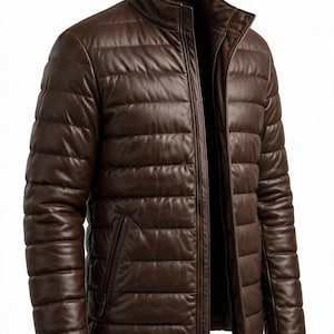 May include: A dark brown leather jacket featuring a quilted, horizontal-stitched pattern throughout the body and sleeves. The jacket includes a stand-up collar, a full-length front zip fastening, and two side pockets with vertical zip fastenings.