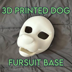 May include: A 3D-printed white dog head fursuit base. The mask features large eye openings, a prominent snout, and an open mouth. The text "3D PRINTED DOG" and "FURSUIT BASE" are displayed in green.