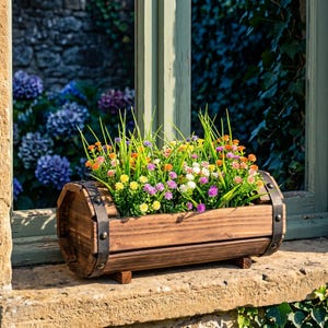 May include: A white ceramic mug with a black handle and the text "But First, Coffee" in a black, handwritten-style font. The mug is on a white surface.