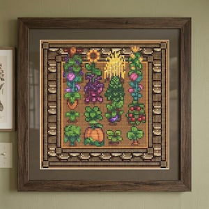 May include: A framed cross-stitch embroidery featuring a grid of various garden plants, including a pumpkin, sunflowers, and leafy greens, set against a brown background within a dark wood frame with a wide, dark brown mat border.
