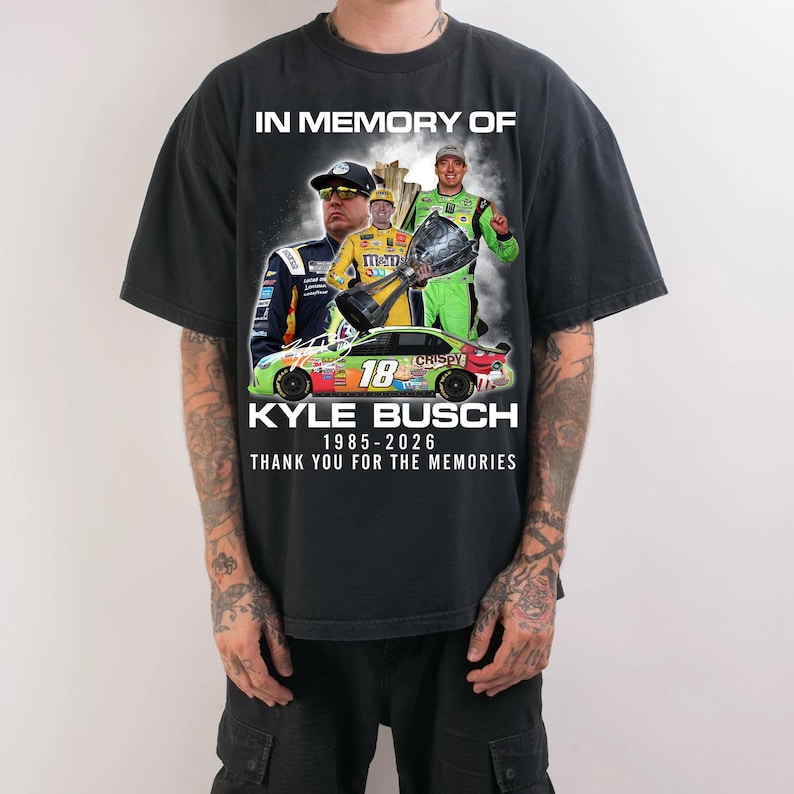 May include: Black t-shirt featuring a graphic tribute to Kyle Busch. The design includes images of Busch, a race car, and the text "IN MEMORY OF KYLE BUSCH 1985-2026 THANK YOU FOR THE MEMORIES."