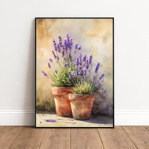 Puede incluir: Una impresión en acuarela enmarcada que presenta dos macetas de terracota llenas de plantas de lavanda. Las flores de lavanda son de un púrpura vibrante, contrastando con el follaje verde y los tonos cálidos de las macetas. El fondo tiene una apariencia suave y texturizada.