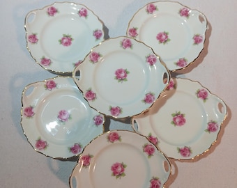 CAPEANS Set van 6 kleine bordjes · Vintage Spaans porselein, roze rozen, gouden rand, opengewerkte handvatten, midden 20e eeuw