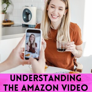 May include: A woman smiles while holding a cup of coffee, being filmed by a smartphone. The phone displays a video of the woman. The image includes the text "UNDERSTANDING THE AMAZON VIDEO REVIEW PROGRAM".