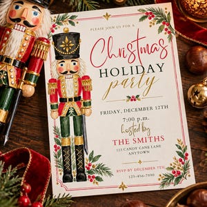 May include: A rectangular Christmas holiday party invitation card featuring a watercolor nutcracker illustration, red and green holly accents, and black and gold text reading: Please join us for a Christmas holiday party, Friday, December 12th.