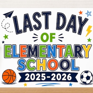 May include: A white sign with the text "LAST DAY OF ELEMENTARY SCHOOL 2025-2026" in navy blue, green, orange, and yellow. The sign includes illustrations of a paper airplane, stars, a basketball, and a soccer ball. A small potted plant and a pencil holder are visible.