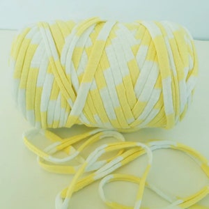 May include: A ball of yellow and white striped yarn. The yarn is made of soft, stretchy fabric and is perfect for crocheting or knitting.