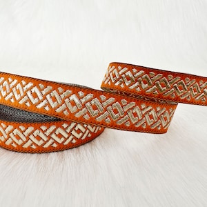 15 mm (5/8 inches) orange and gold trim by the yard_trim and border, orange jacquard border