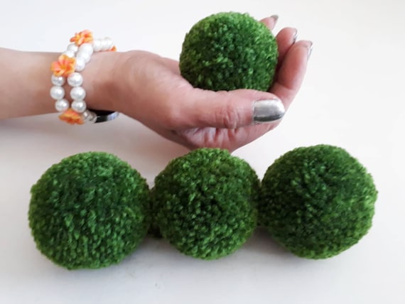 green yarn pom poms
