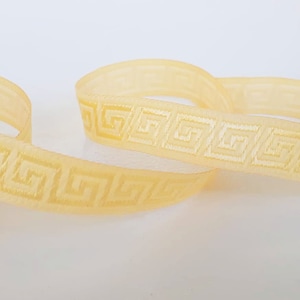 15 mm (5/8 inches) Greek key trim in warm cream colors, greek key jacquard ribbon