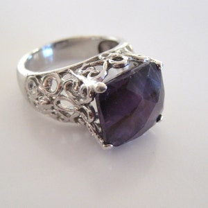 Vintage 925 sterling silver ring. Beautiful faceted amethyst stone.  Size 7 and a half.