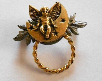 Vintage gold angel pin or slide.