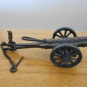 Vintage mini cannon replica.  Cast iron cannon. Six inch mini cannon.  Toy cannon.   Cannon sharpener.  Vintage pencil sharpener.