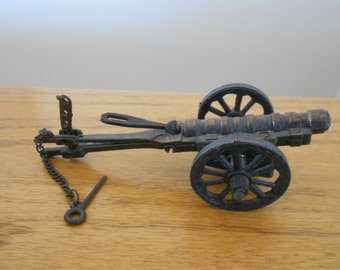 Vintage mini cannon replica.  Cast iron cannon. Six inch mini cannon.  Toy cannon.   Cannon sharpener.  Vintage pencil sharpener.