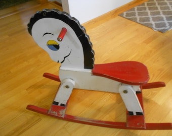 Antique wooden rocking horse.  Ride on toy for children.  Pony for kids.