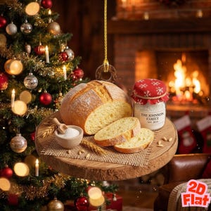 May include: A round loaf of bread, partially sliced, on a wooden serving board with a small bowl of flour and a jar with a red lid. The jar has the text "THE JOHNSON FAMILY EST. 2024". A Christmas tree is in the background.