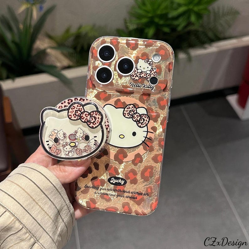 Cute Hello Kitty Leopard Print MagSafe Phone Case with Stand, Kawaii iPhone Case, Protective Cover for iPhone 17 Pro Max, iPhone 16 Pro Max MagSafe Case + Grip