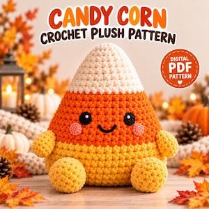 May include: A crochet plush toy shaped like a candy corn with a white top, orange middle, and yellow base. It features black eyes, a black smile, and pink cheeks. The text reads CANDY CORN CROCHET PLUSH PATTERN and DIGITAL PDF PATTERN.