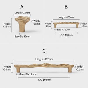 May include: Three gold-toned metal cabinet hardware pieces labeled A, B, and C. Piece A is a knob with a 34mm length, 30mm width, 34mm height, and 12mm base diameter. Piece B is a handle with a 153mm length, 19mm width, 31mm height, 10mm base diameter, and 128mm center-to-center distance. Piece C is a handle with a 192mm length, 21mm width, 34mm height, 13mm base diameter, and 160mm center-to-center distance.