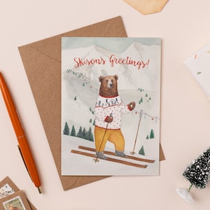 Carte de Noël de voeux de Skions de Zazzle.be Liste d'envies Vous avez des idées ? pour les Fêtes de ski mignon d'ours de Zazzle.be Liste d'envies Vous avez des idées ? Illustration de jeu de mots sur le ski | Carte de Noël de voeux de Noël | Carte Ours polaire