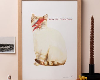 May include: A watercolor painting of a white cat with a red and blue lightning bolt over its eye. The cat is sitting and looking to the right. The text "DAVID MEOWIE" is written in black above the cat.