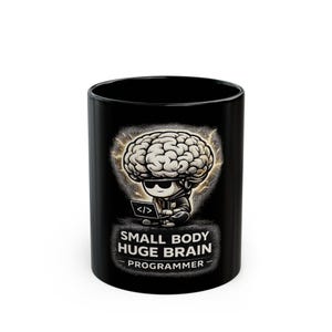 May include: Black ceramic mug with a cartoon programmer design. The image shows a programmer with a brain-shaped head, sunglasses, and a laptop. The text "SMALL BODY HUGE BRAIN PROGRAMMER" is below the image. Ideal for programmers and tech enthusiasts.