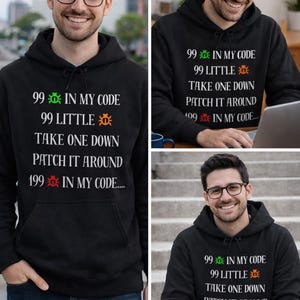 May include: Black hoodie featuring the text "99 in my code, 99 little, take one down, patch it around, 199 in my code..." in white, green, and orange. The hoodie has a front pocket and a drawstring hood. The person in the image is wearing glasses.