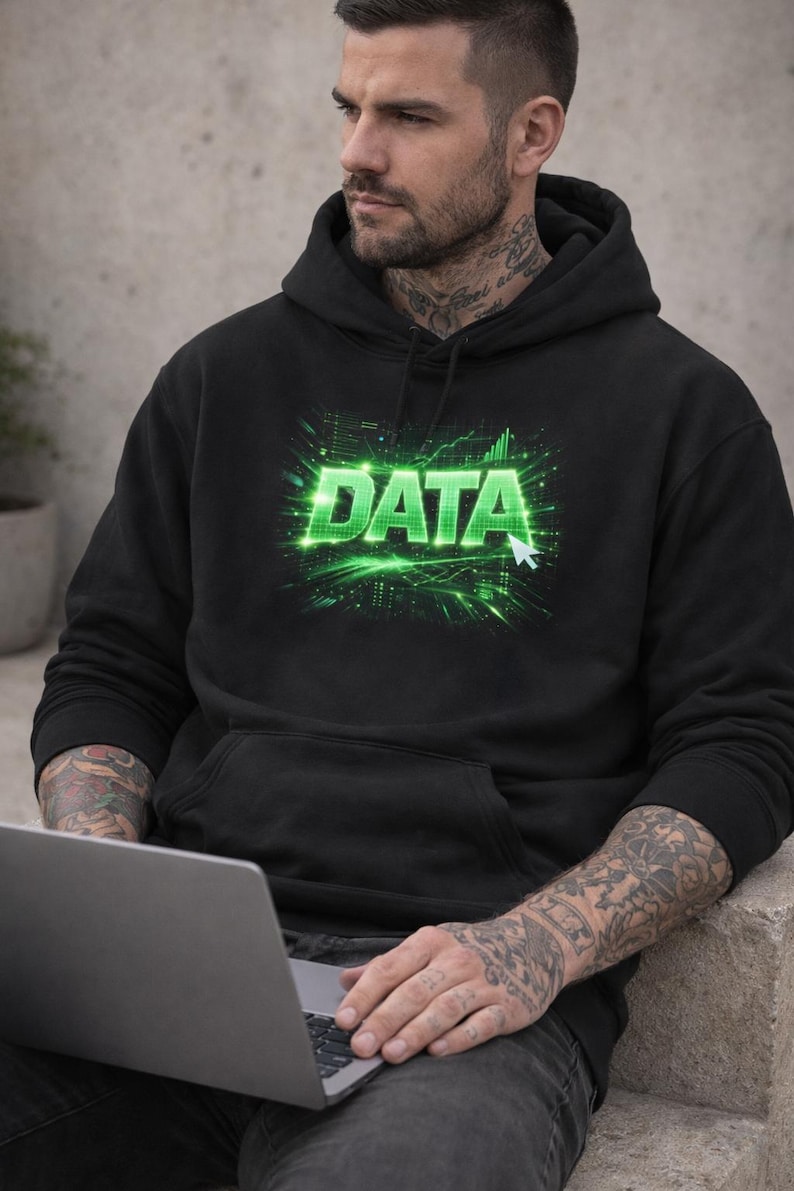May include: Black hooded sweatshirt with the word "DATA" in bright green, set against a digital circuit board design. The person is wearing the hoodie and holding a laptop.