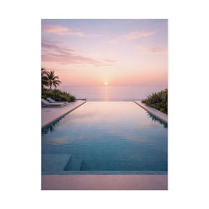 May include: A serene image of a pool overlooking the ocean at sunset. The water in the pool reflects the pink and orange hues of the sky. Palm trees and lounge chairs are visible on the left side, adding to the tropical ambiance.